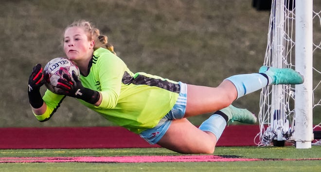 Arrowhead keeper Livia Guadagno (1) makes a save during the match at Pewaukee, Friday, April 12, 2024.
