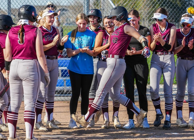 Menomonee Falls teammates welcome Danika Berge (42) to the plate after a home run in the game at Brookfield Central, Monday, April 15, 2024.