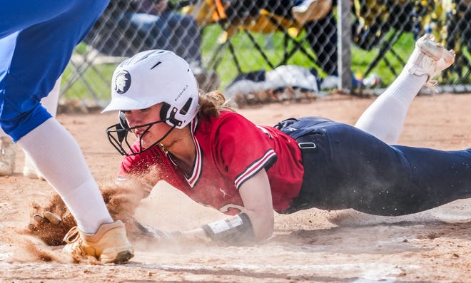 Brookfield East's Chloe Wahlen (23) scores on a wild pitch during the game at Germantown, Tuesday, April 23, 2024. Germantown won 4-2.
