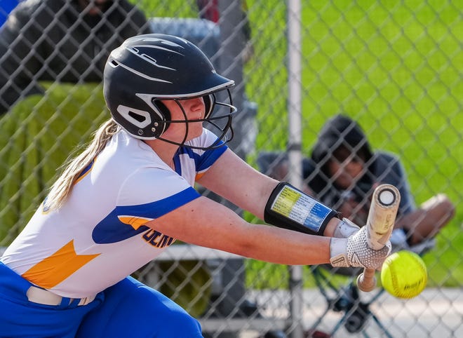 Germantown's Alaina Williams (00) bunts during the game at home against Brookfield East, Tuesday, April 23, 2024.