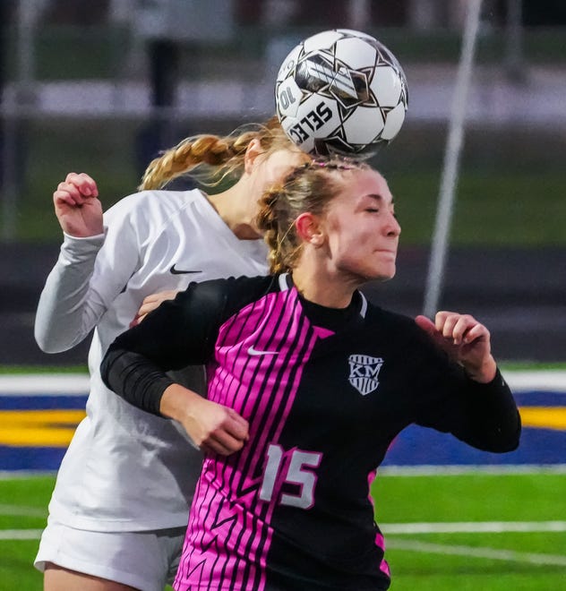 Kettle Moraine's Kendal Moore (15) battles for a header with Brookfield East's Olivia Gardner (9) during the match at Kettle Moraine, Thursday, April 18, 2024.