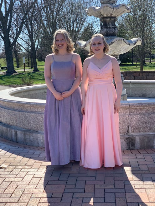 Sisters Abbie (left) and Josie Hart pose for a photo before Hortonville High School's prom on Saturday, April 13, 2024. The dance was held at Homestead Meadows Farm in Appleton.
